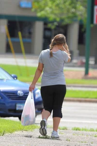 Thick girl out walking in black leggings