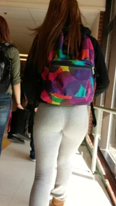 Cute college girl wearing grey leggings