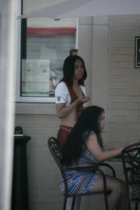 Two sexy Tilted Kilt employees showing cleavage and cheeks