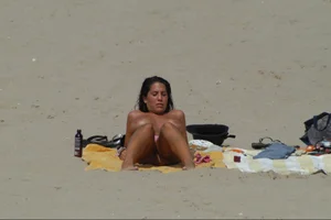 Girls on a nude beach in Sitges, Spain