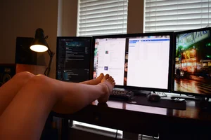 Legs with Bare Feet on the Table Home Candid