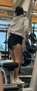 Asian girl in gym shark. Leg and ass workout
