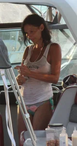 Bikini babe on a boat with a wet see through white shirt showing her tits