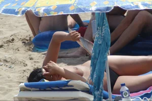 Girls on a nude beach in Sitges, Spain