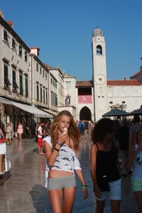 Sexy skinny blonde eating ice cream in short tight grey shorts