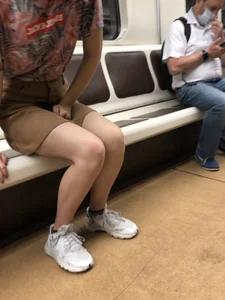 Amazing Hot Girl in a Skirt and Sneakers Sitting Cross-Legged in the Subway Train and on the Escalator Candid Photos Gallery