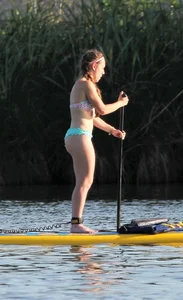 Rowing girl in a bikini with a nice ass