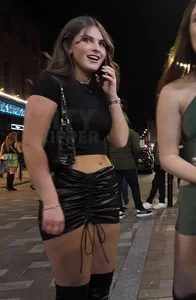 Very pretty girl in short leather skirt and high boots (not OC)