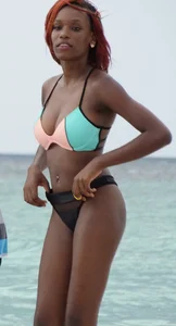 Candid black family, milf and teens on the beach in bikinis