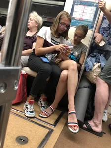 Tall Candid Teen Girl in Denim Shorts And Sandals Sitting in the Subway Train, Then Walking Down the Station