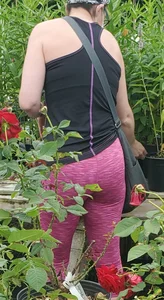 Milf shopping with a nice ass in tight maroon leggings