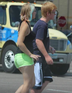 Blonde girl in glasses with a thick booty in green shorts