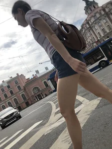 Young Girl in Shorts And Sandals Crossing the Street Gallery