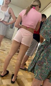 Hot teen chick wearing a pink top and shortrs creepshots, amazing long legs