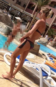 Sexy blonde babe in a bikini at the pool