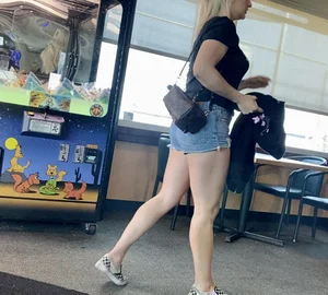 Short shorts and a Louis Vuitton backpack