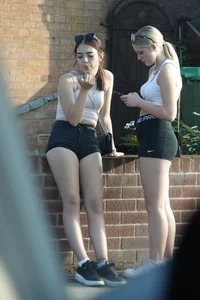 Pair of oblivious teens in short shorts