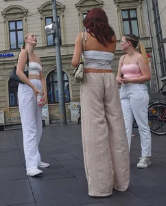 Long blonde braless in a white outfit (many pictures)