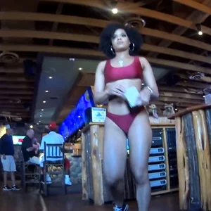 Sweet ebony waitress in a bikini