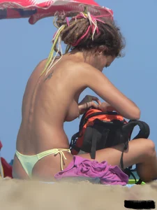 Sexy girls going topless at the beach showing off their sexy bodies