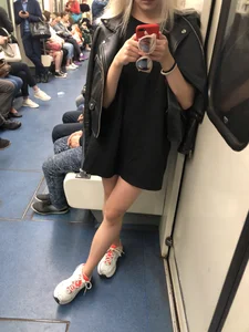 Blonde in a Dress and Sneakers With Sexy Skinny Legs in the Subway Train and on the Escalator Closeup Candid Photos