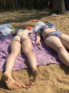 Cute Girl in Swimsuit Standing in Water and Lying on a Beach Gallery