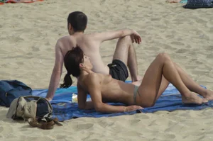 Topless girls on a beach in Barcelona