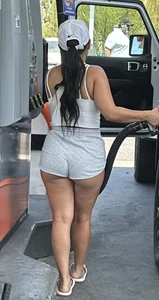 Sexy fit latina with cheeks coming out of booty shorts