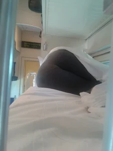 Girl in leggings asleep in train