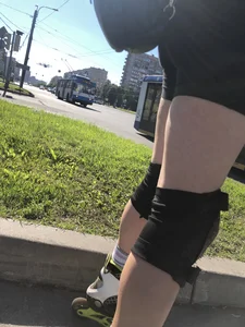 Fit Girl in Spandex Shorts And Knee Pads on Roller Blades Street Creepshots