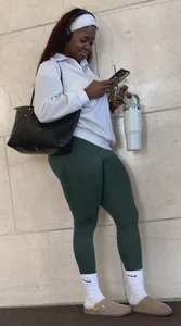 Ebony with a DEEP WEDGIE  in Green Leggings