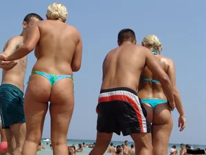 A bunch of sexy beach voyeur babes in bikinis, thongs and topless