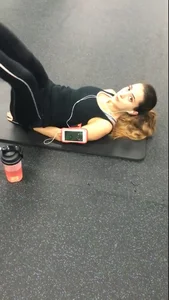 Sexy gym girl with a nice body in leggings as she works out
