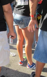 Brunette babe standing around in denim shorts