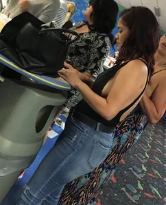Thick brunette in tight jeans and showing some side boob