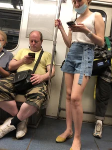Girl in Blue Denim Shorts and Flats Standing in Subway Train - Nice Legs Closeup