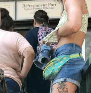 Tatted up hippie in short jean shorts with a nip slip