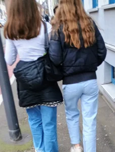 Two teens in blue jeans, one has a hot skinny ass