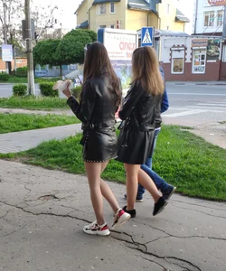 Two college girls wearing leather skirts walking down the street creepshots