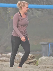 Beach volleyball blonde lady in tight leggings