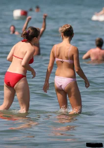 A bunch of sexy beach voyeur babes in bikinis, thongs and topless