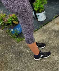 Milf booty in tight leggings shopping for plants
