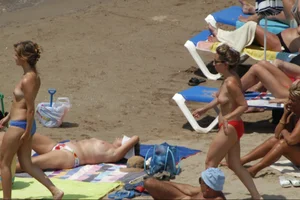 Girls on a nude beach in Sitges, Spain
