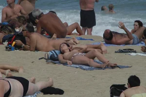 Topless girls on a beach in Barcelona