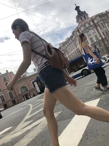 Young Girl in Shorts And Sandals Crossing the Street Gallery