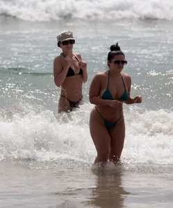 Thick and skinny friends on the beach in thongs