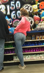 Candid teen in tight blue jeans at the fun fair