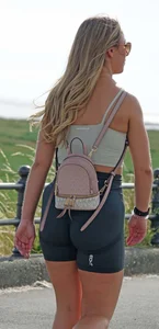 Blonde woman in lycra shorts - good front view, back view ruined by a bag