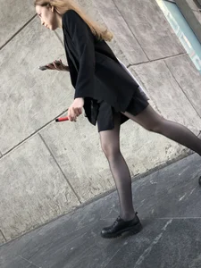 Great legs in black pantyhose, candid girl walking down the street