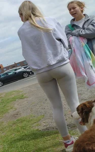 Pretty blonde in white leggings at the beach